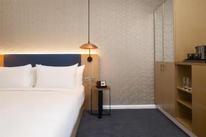 Ένα ή περισσότερα κρεβάτια σε δωμάτιο στο Hilton Garden Inn Bristol City Centre