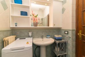 a small bathroom with a sink and a mirror at La Casa in Gallura piano terra in Calangianus +13 photos