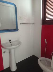 a bathroom with a sink and a toilet at Tiny Villa Homestay - Only For Foreign Bookings in Kurunegala