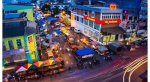 an overhead view of a busy city street at night at I-Winton Hotel in Mentekab