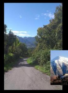 a dirt road with a view of a mountain at Il Borgo del Ghiro in Irola