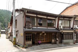 an old building on the side of a street at Gujo BASE in Gujo