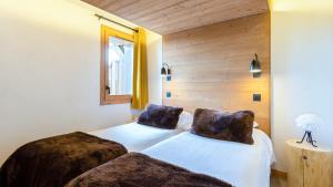 Postel nebo postele na pokoji v ubytování ASAI210-9-2 Appartement 4 étoiles - Les Saisies - 8 personnes