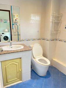 a bathroom with a toilet and a sink at TONY Central Stay in Phuket Town
