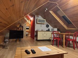 a living room with a table and a kitchen at Pokoje Gościnne u Grażyny in Ojców +67 photos