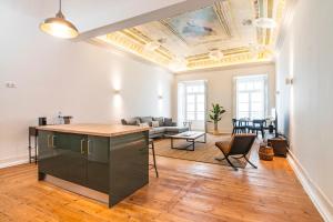 an apartment with a living room with a ceiling at CICIOSO flats João de Deus 1 in Évora
