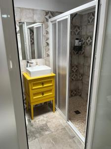 a bathroom with a sink and a shower with a mirror at Casa Vladimir in Arcos de la Frontera +27 photos