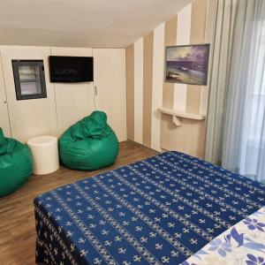 Ένα ή περισσότερα κρεβάτια σε δωμάτιο στο Hotel Sorriso - molto più di una stella