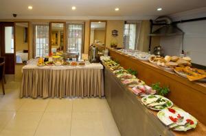 a buffet line with many different types of food at New House Hotel in Istanbul