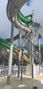 a water slide at a park with a slide at MOBIL HOME CONFORT PLUS - 40m2 - 3ch - 2 SDB - Camping 4 étoiles - BONNE ANSE 56 in Les Mathes