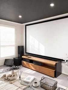 a large projection screen in a living room at Bluewater sanctuary in Tascott