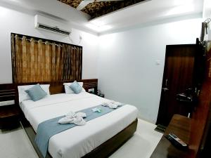 Ένα ή περισσότερα κρεβάτια σε δωμάτιο στο Hotel Kiara Govind Park