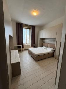 En eller flere senge i et værelse på Locazione turistica La casa dei limoni