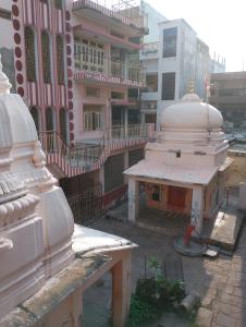 an outside view of a building with a mosque at Shreeji niwas in Varanasi