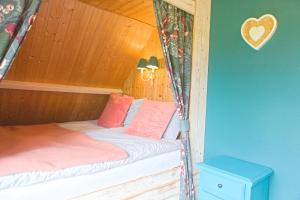 Ένα ή περισσότερα κρεβάτια σε δωμάτιο στο Vakantiewoning buitenaf