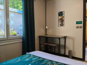 Postel nebo postele na pokoji v ubytování Domaine du vieux tilleul- Appartements - Gorges Tarn et Jonte