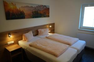 Katil atau katil-katil dalam bilik di Ferienhaus Mott