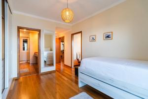 Ένα ή περισσότερα κρεβάτια σε δωμάτιο στο GuestReady - Madeiran paradise with ocean view +47 φωτογραφίες