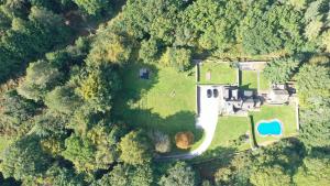 an aerial view of a house in the forest at Danby Lodge in Yorkley