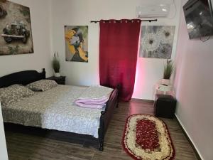 Ένα ή περισσότερα κρεβάτια σε δωμάτιο στο Casa Rico 2