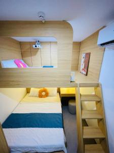 Postel nebo postele na pokoji v ubytování Emly Home Stay Đà Nẵng