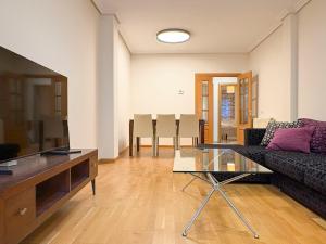 a living room with a couch and a table at Los Amantes de Teruel viven aquí in Teruel