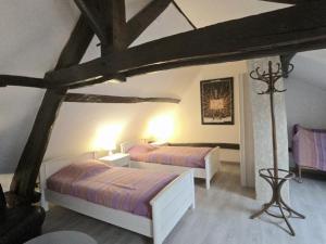 Una cama o camas en una habitación de Gîte périgourdin avec WiFi, jardin, barbecue, proche sites historiques et randonnées - FR-1-616-71