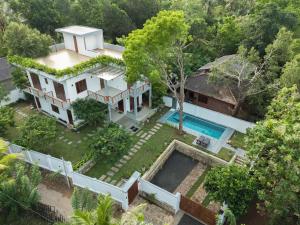 an aerial view of a house with a swimming pool at Villa Sathkara in Tangalle