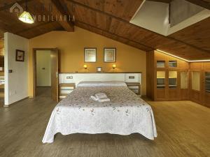 a bedroom with a bed with a white bedspread at Blue Wellness Villa in Elche +49 photos