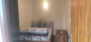 Giường trong phòng chung tại Yang's Stay