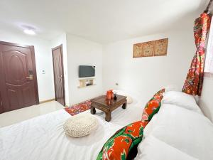 Ένα ή περισσότερα κρεβάτια σε δωμάτιο στο Xuegu Nannan B&B