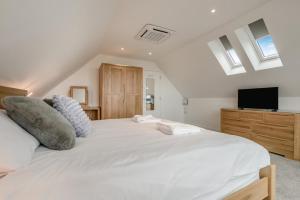 a bedroom with a large white bed and a tv at 2 Bed in Tintagel oc-g33170 in Tintagel