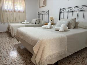 Postel nebo postele na pokoji v ubytování Casa Riondas + 26 fotografií