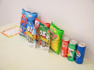 a row of four packs of chips and cans of soda at Bazan Dalat Hotel in Da Lat +35 photos