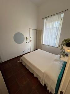 Postel nebo postele na pokoji v ubytování il Casale di Adriana