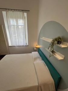 Postel nebo postele na pokoji v ubytování il Casale di Adriana