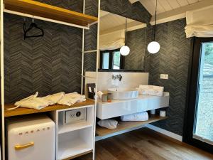a bathroom with a sink and a mirror at De la Osa Hotel in Abres +51 photos