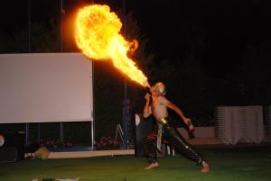a man in a fire costume with a fire trail at Siesta Beach Apartment in Gümbet +83 photos