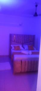 Giường trong phòng chung tại Mafric homes 1bedroom apartments