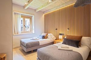 Ένα ή περισσότερα κρεβάτια σε δωμάτιο στο Luderna - Apartamento con jardín Crabera