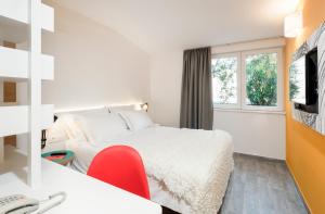 Uma TV ou centro de entretenimento em Pharos Hvar Bayhill Hotel