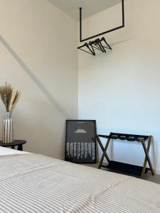 a bedroom with a bed and a tv at OverGarden Rooms in Dossobuono +38 photos