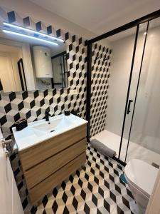 a bathroom with a sink and a toilet at Apartamentos La Pinilla in La Pinilla +14 photos