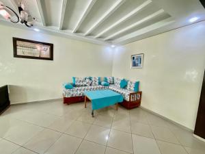 a living room with a couch and a table at Luxury apartment Fes centre ville - Family & Friendly in Fès