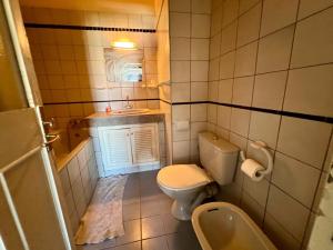 a small bathroom with a toilet and a sink at Luxury apartment Fes centre ville - Family & Friendly in Fès +36 photos