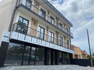 a building with a balcony on top of it at Dreams home in Uzhhorod