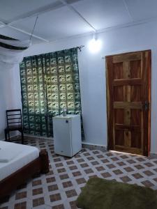 Ένα ή περισσότερα κρεβάτια σε δωμάτιο στο Gede Guest Homes