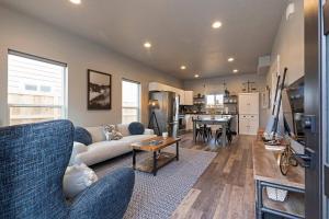a living room with a couch and a table at Modern abode in Central Missoula! in Missoula