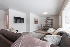 a living room with a couch and a tv at Salish Court in Missoula