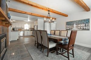 a kitchen and dining room with a table and chairs at Salish Court in Missoula